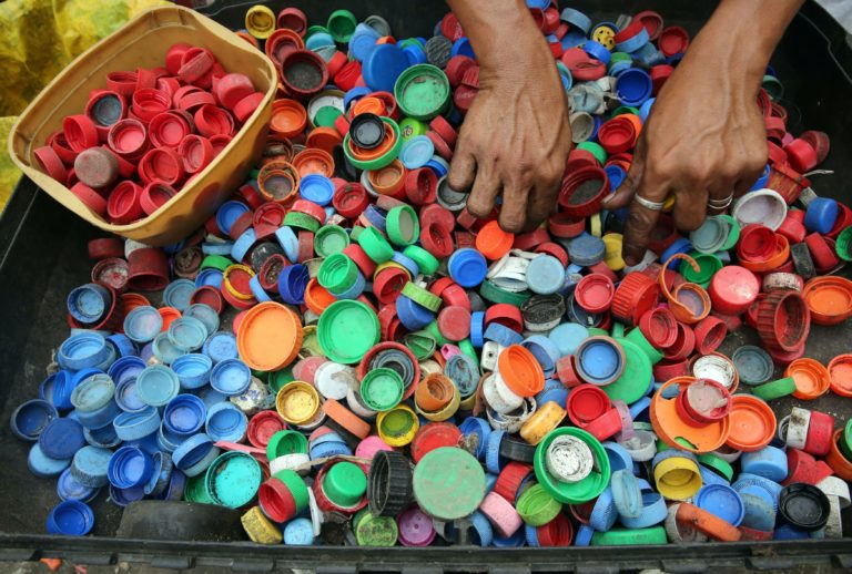 plastic bottle lids all piled up