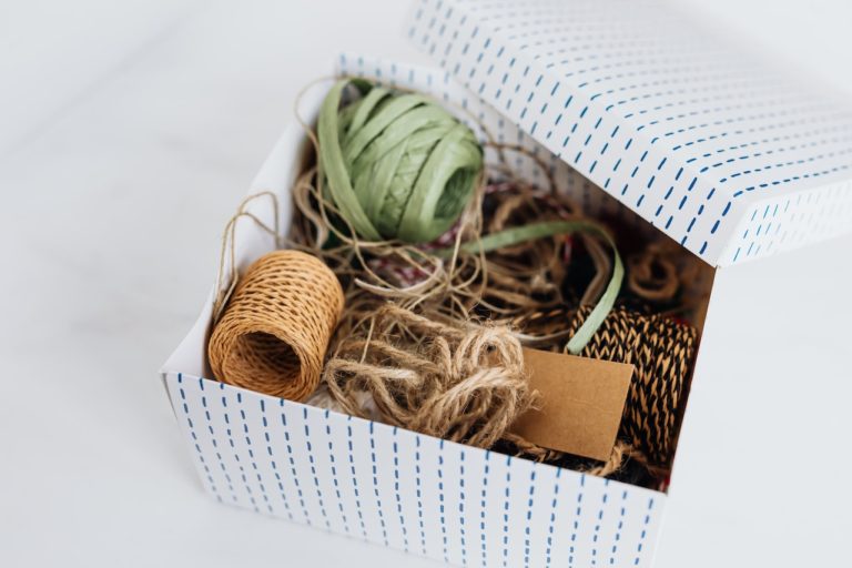 box full of twine and other natural fiber wrappings