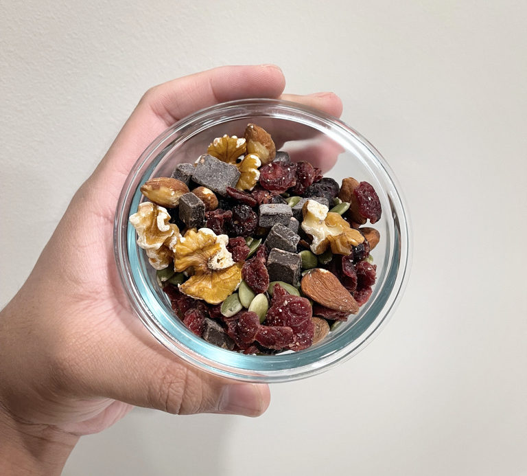 1 cup snapware container holding trail mix