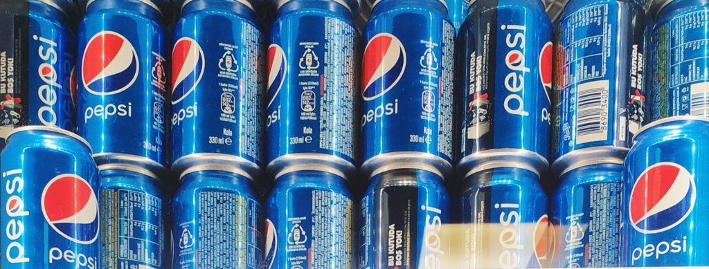 pepsi cans stacked up in fridge, recyclable aluminum cans