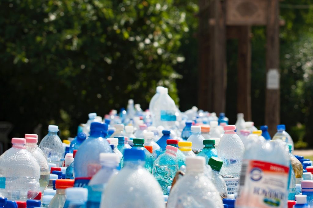 plastic cartons and jugs lined up to be recycled