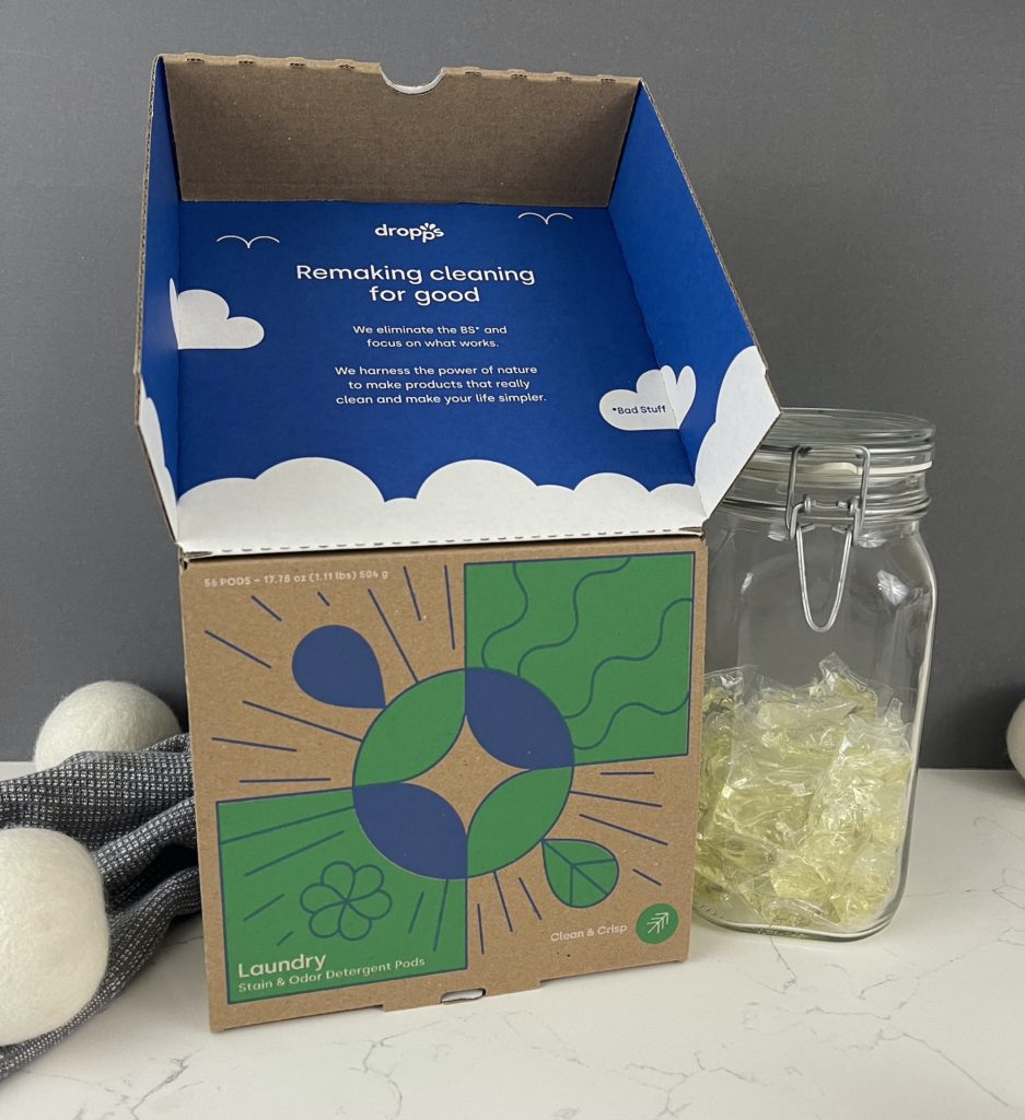 dropps laundry pods in compostable box with flap open showing pods