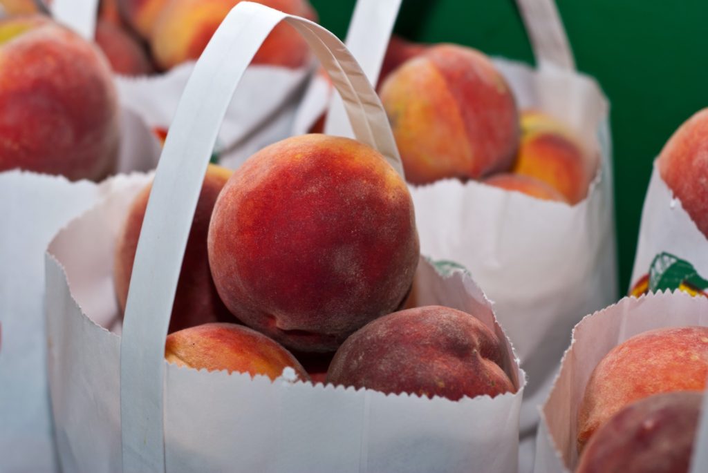 peaches in paper bag